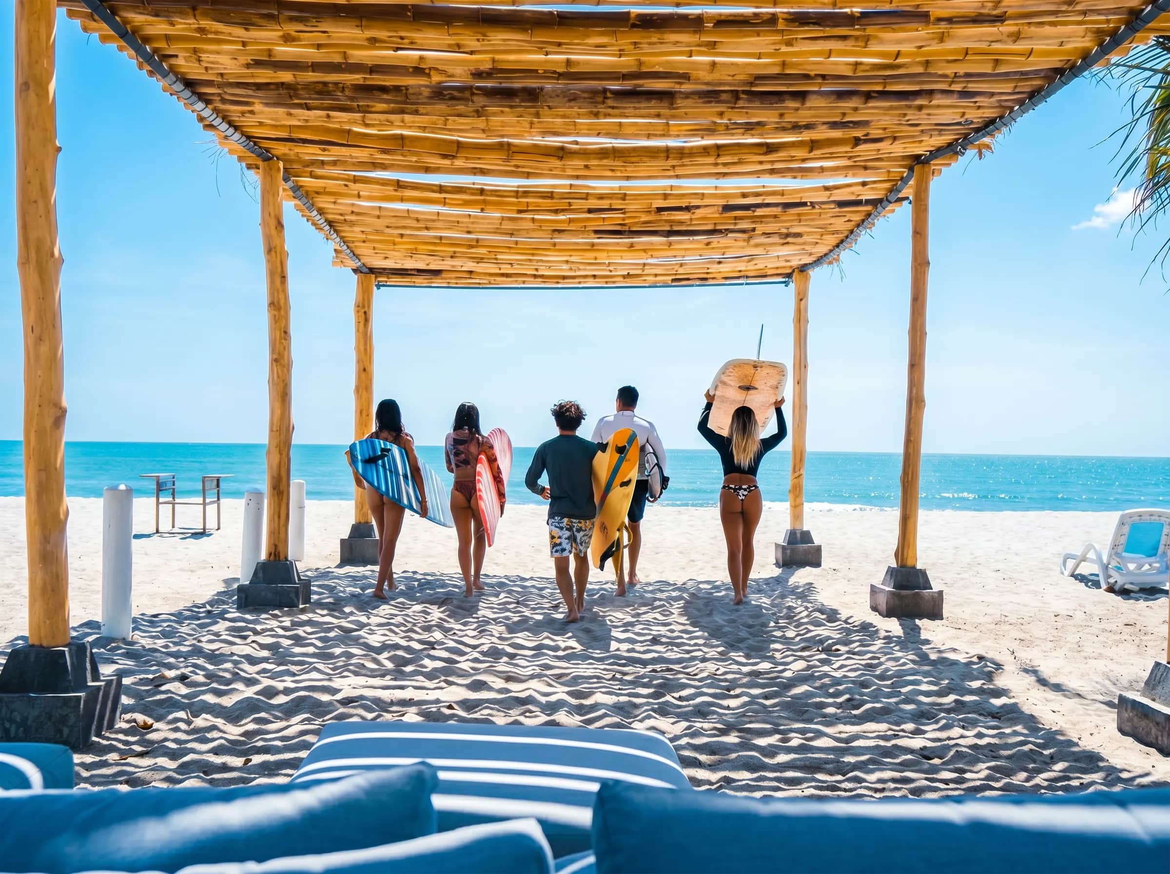 Group heading into the water with their surfboards
